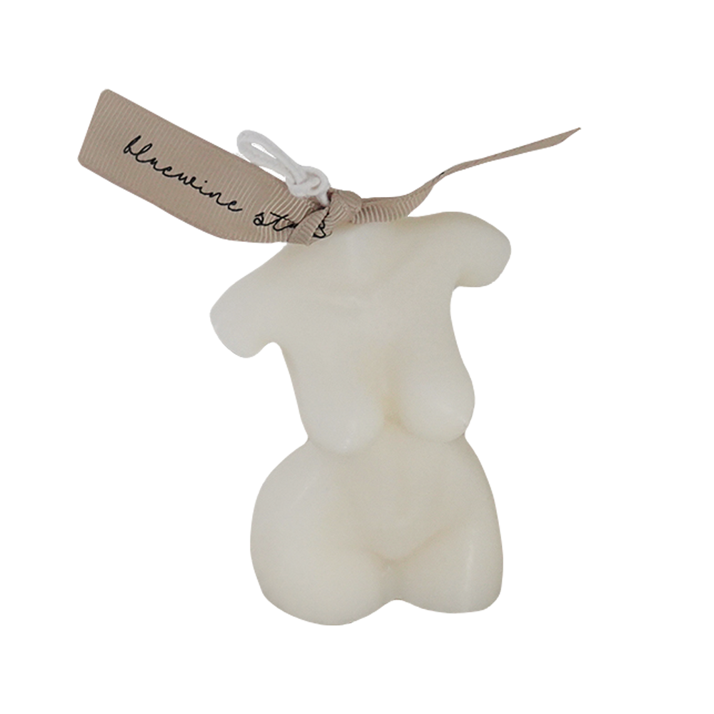 feminine small size body shape white soy pillar candle with beige bluwine studio ribbon on white table