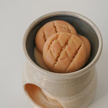 butter cookie wax melts placed in a handmade ceramic wax warmer