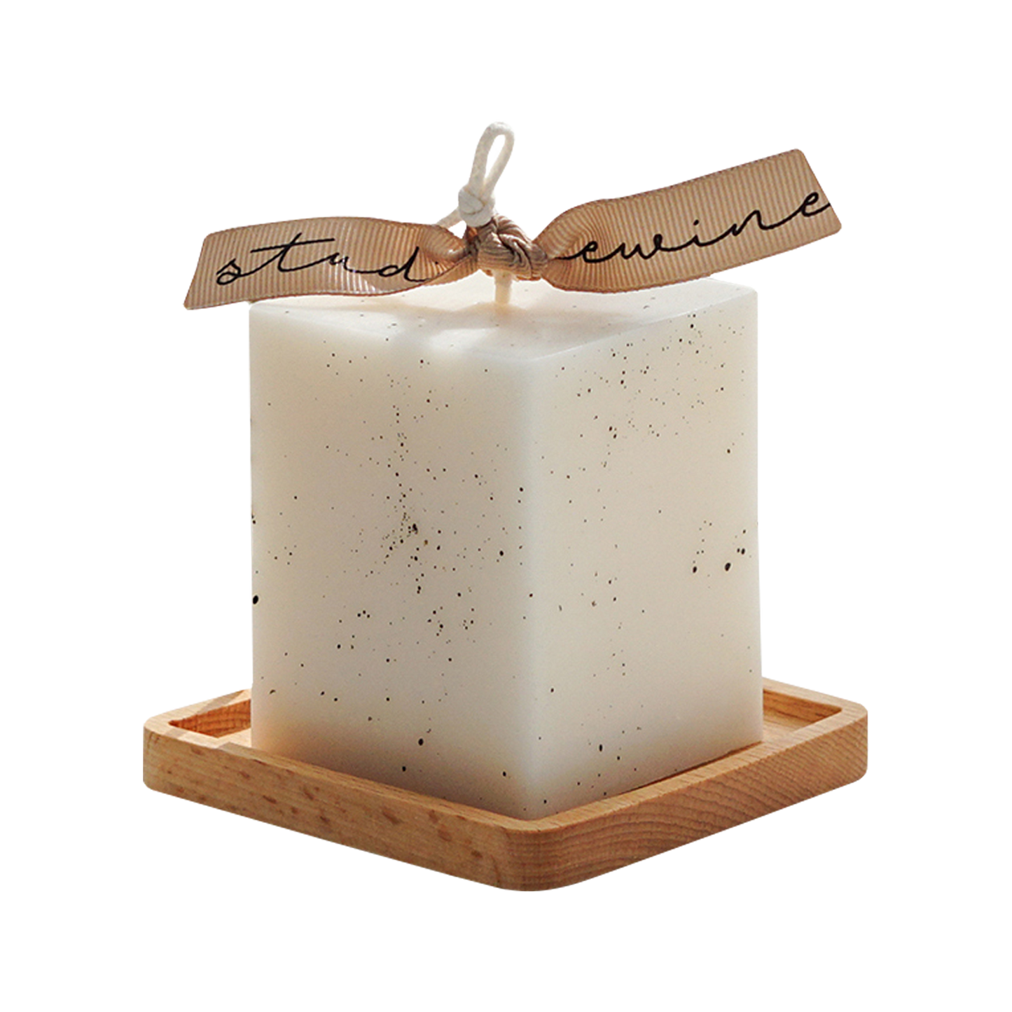 a dotted white square pillar candle with beige bluewine studio ribbon on a square wood coaste
