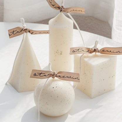 dotted white soy pillar candle collection: sphere, cylinder, pentagonal pyramid, square pillar shape