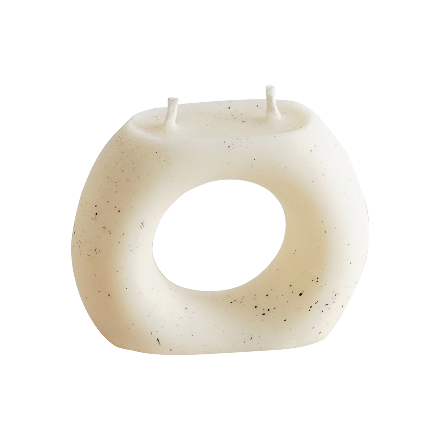 a dotted ring donut shaped white soy pillar candle