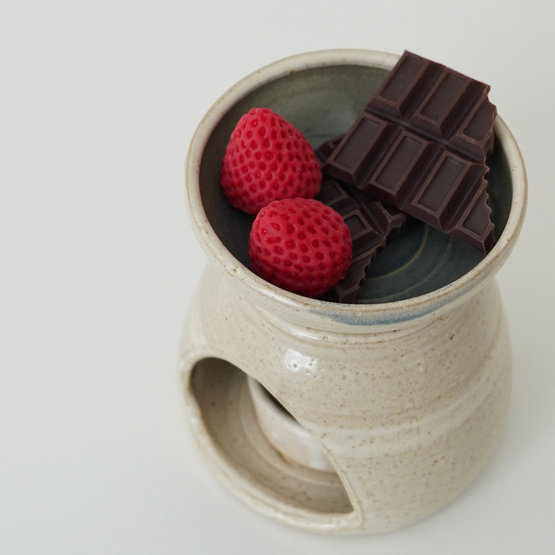chocolate and strawberry wax melts in a wax warmer