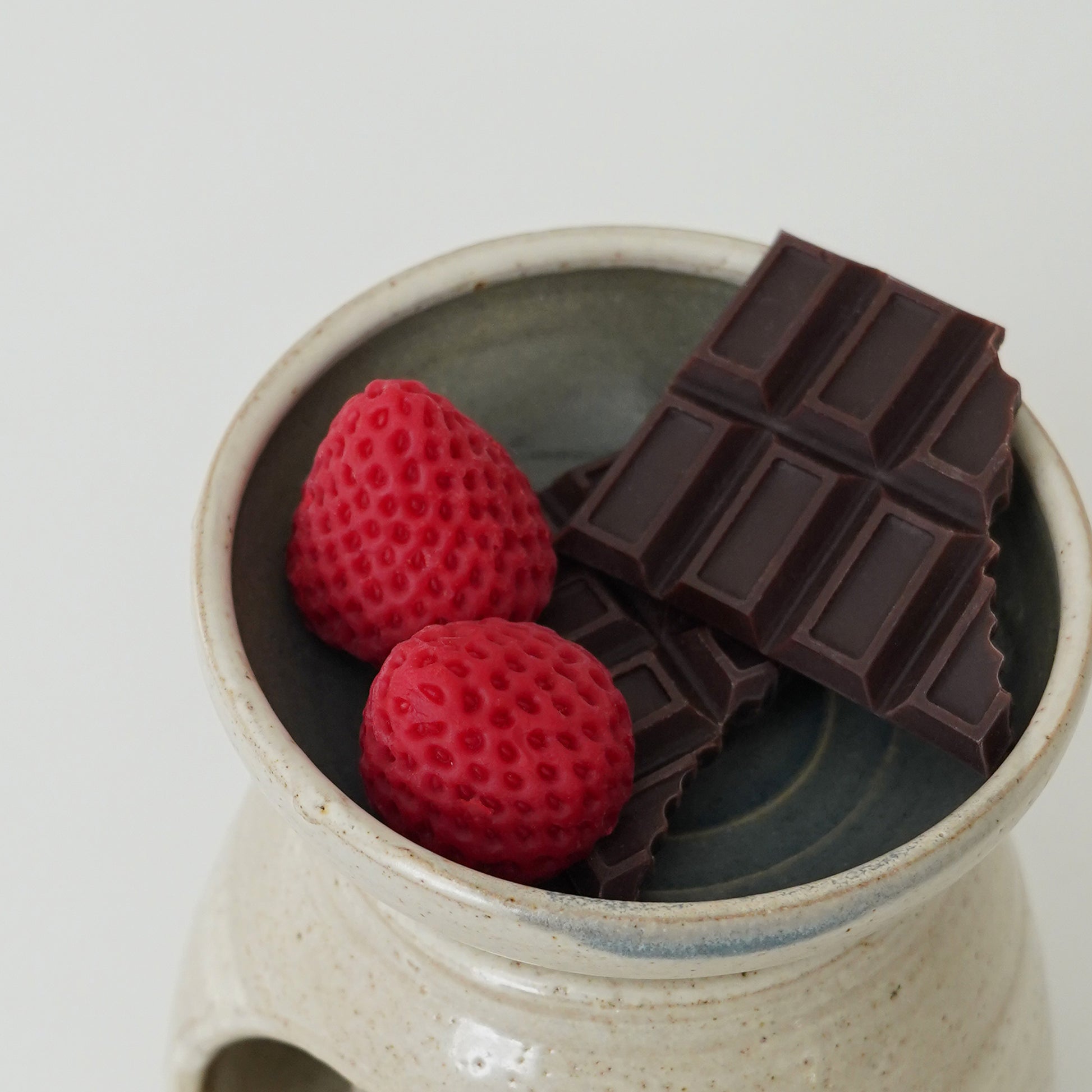 chocolate and strawberry wax melts in a wax warmer