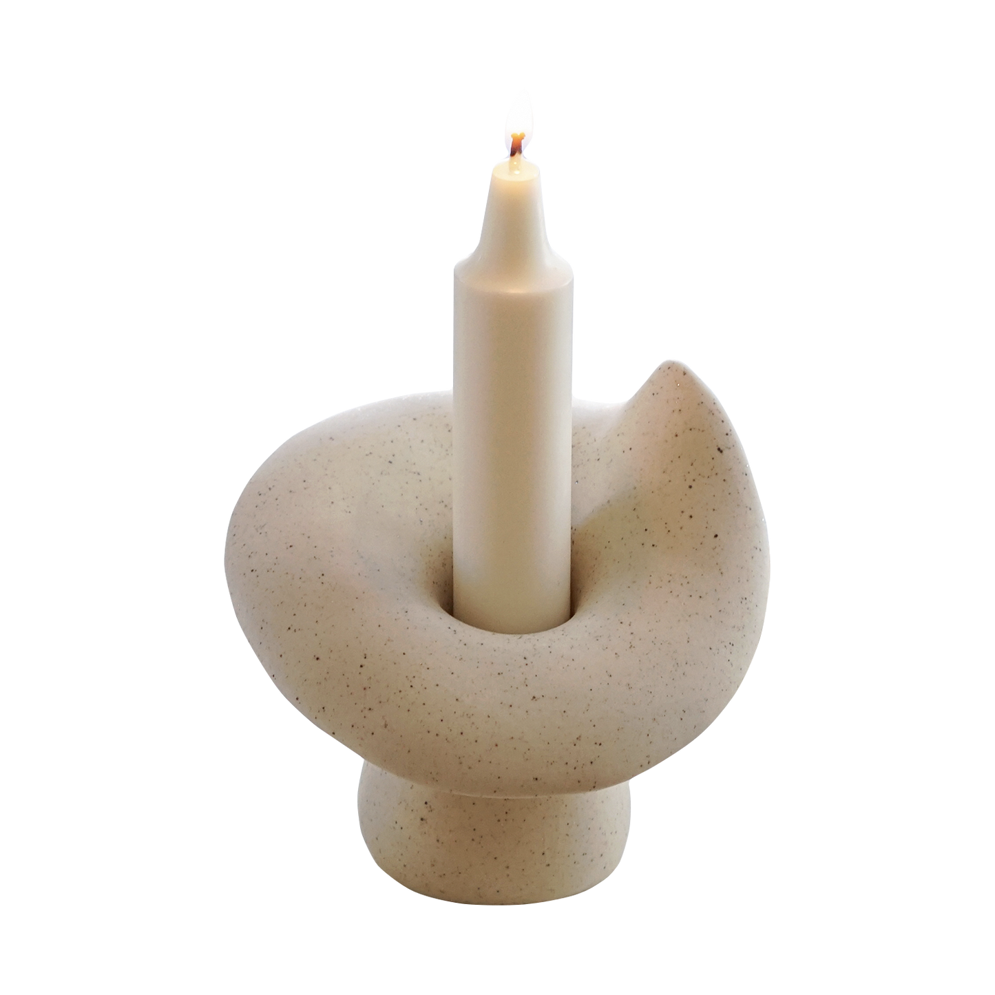 a lit crayon shape soy pillar candle in a ceramic mushroom shape candle holder