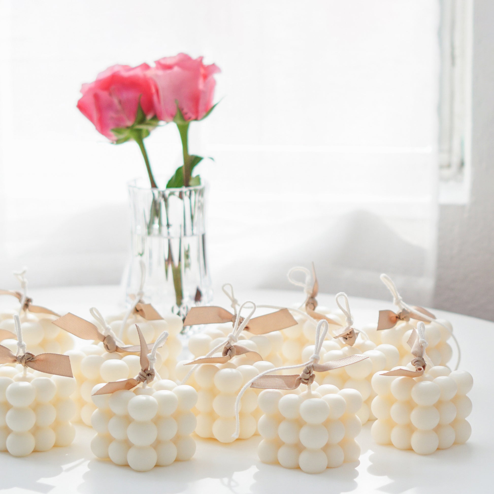 a large order of white cube candles on table