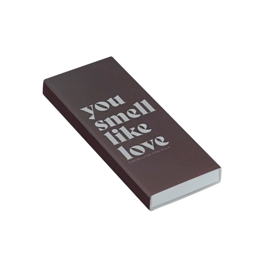 a brown matchbox inscribed with "you smell like love"
