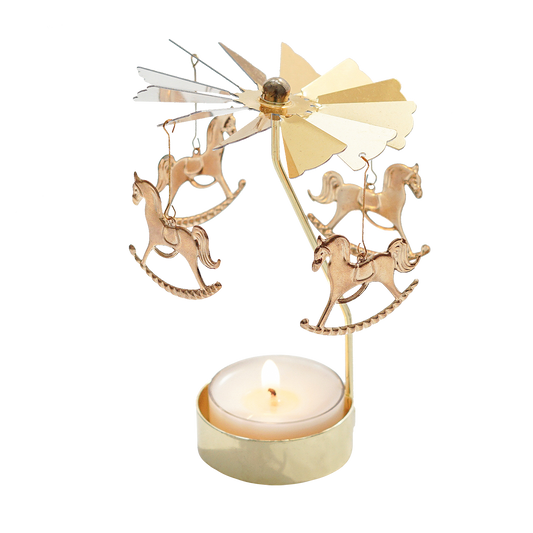merry-go-round gold tealight candle holder with a lit tealight candle