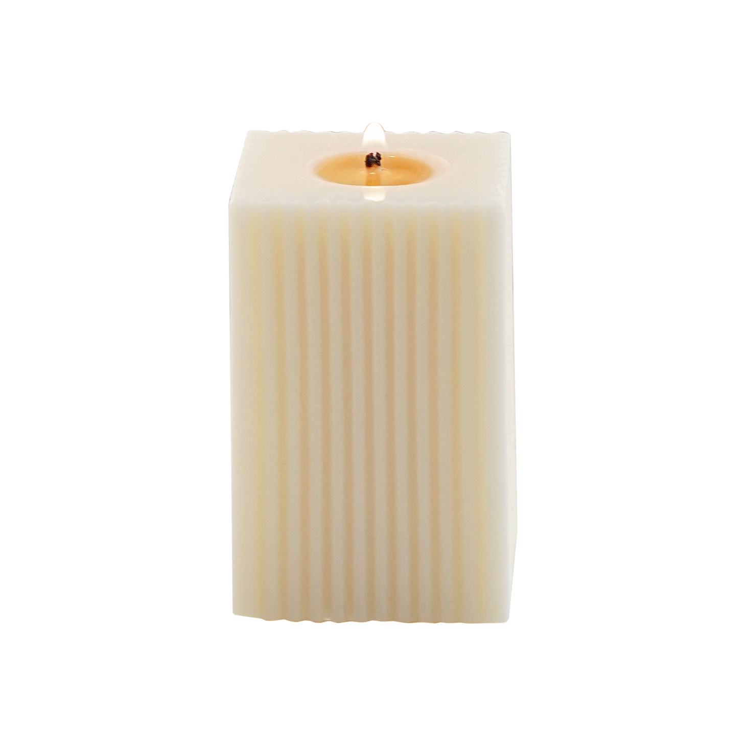 a lit ribbed square pillar candle