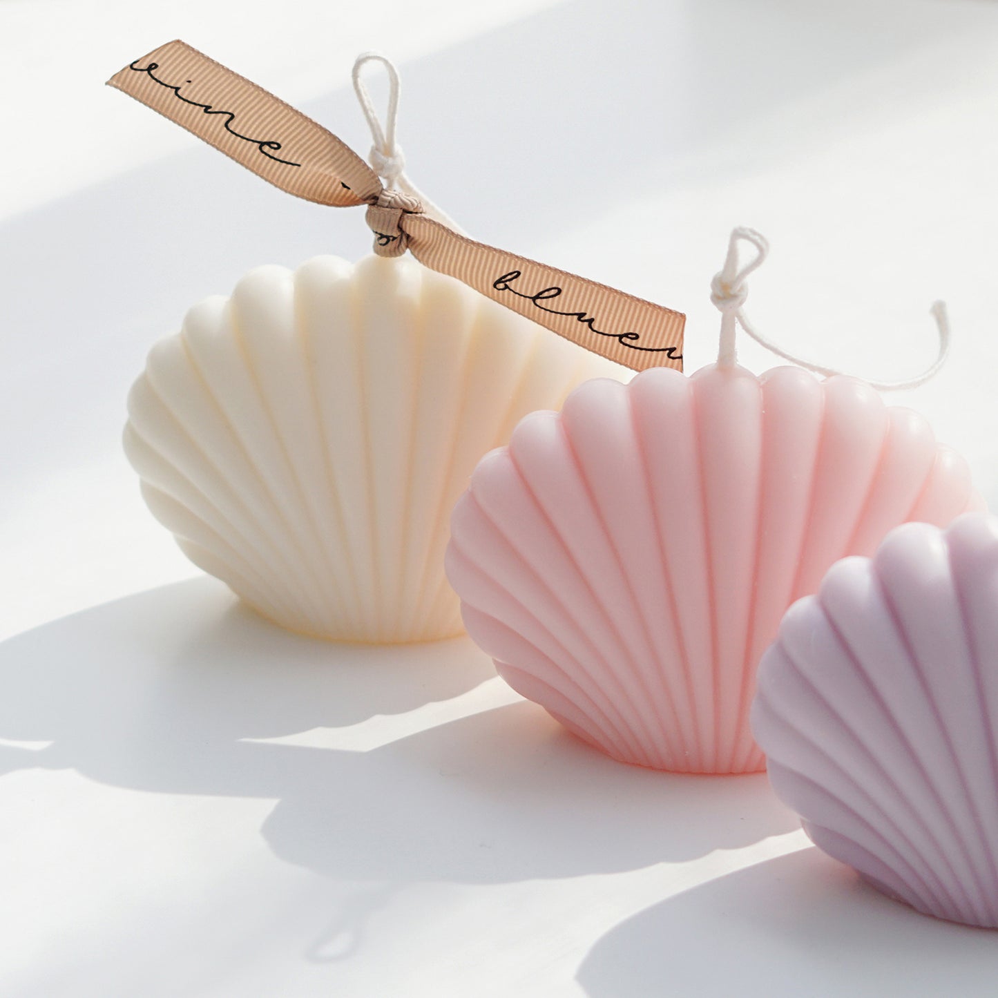 white, pink, lavender seashell shape soy pillar candles