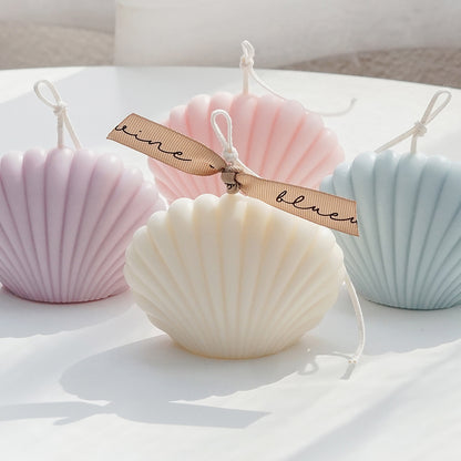 white, pink, lavender, and aqua blue seashell shape soy pillar candles