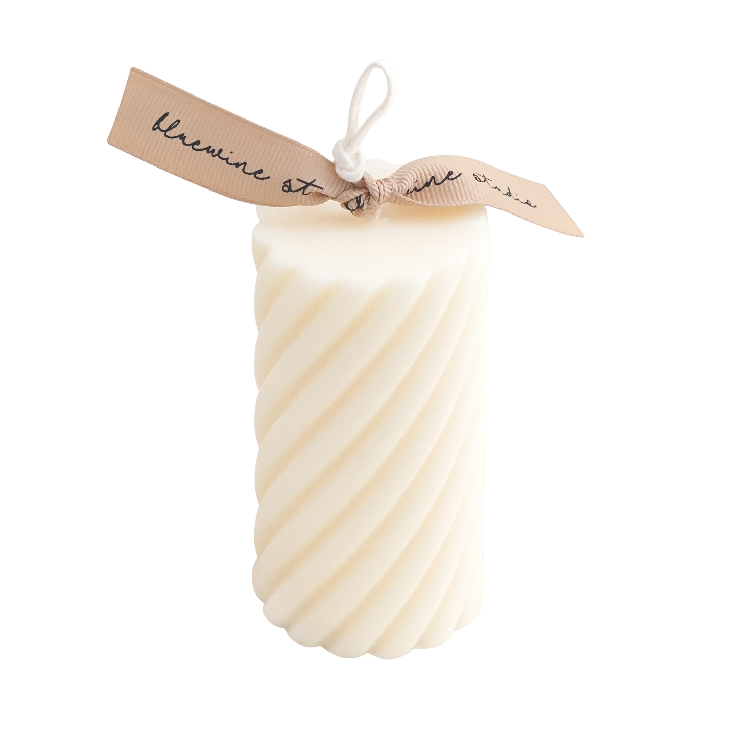 white spiral soy pillar candle with beige ribbon