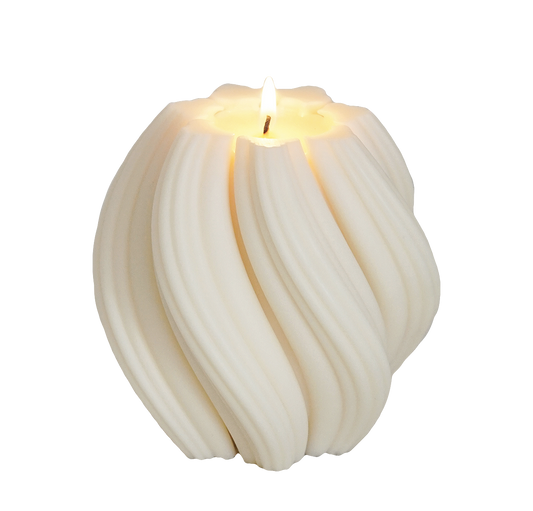 a lit swirl shape sculptural soy pillar candle