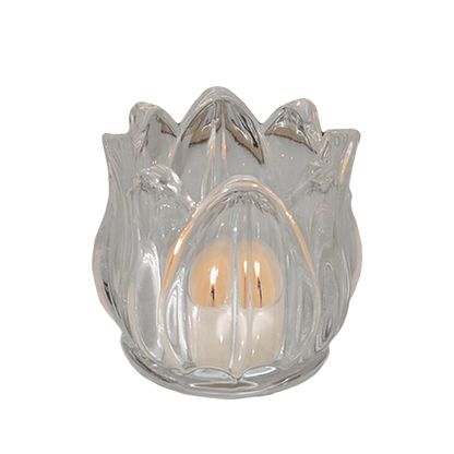 a lit tealight candle in a tulip flower shape glass tealight candle holder