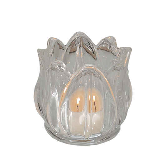a lit tealight candle in a tulip flower shape glass tealight candle holder
